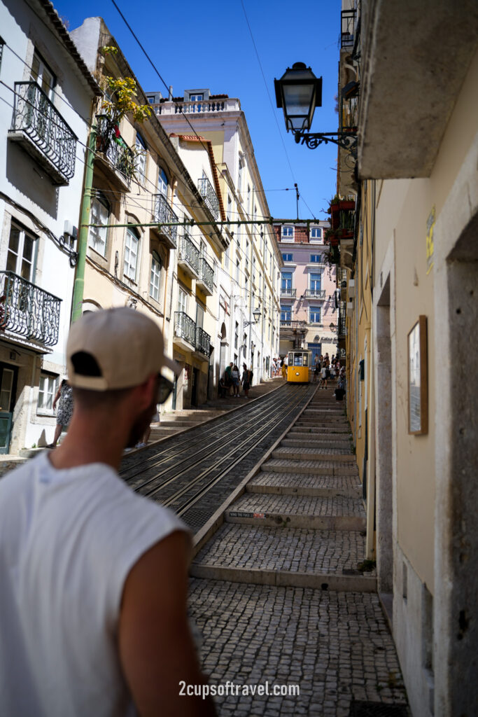 things to do yellow lisbon tram where to see R. da Bica de Duarte Belo funicular barrio alto portugal