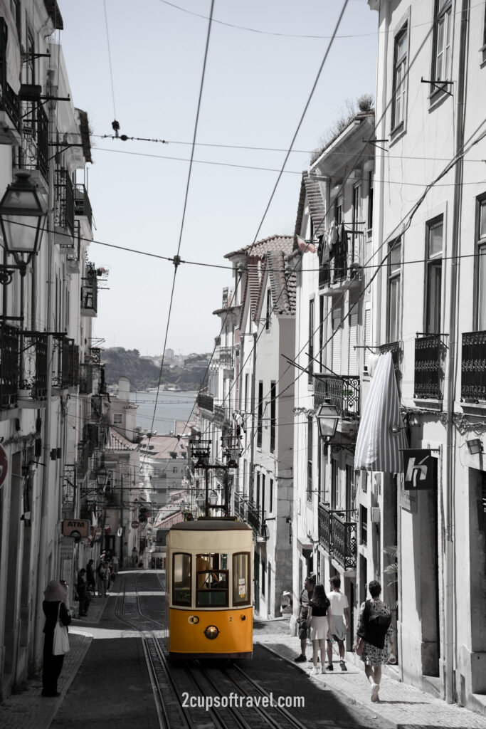 things to do yellow lisbon tram where to see R. da Bica de Duarte Belo funicular barrio alto portugal